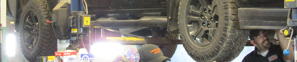 service technician working under a vehicle
